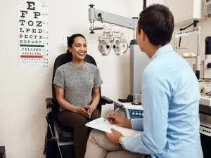 young woman and eye doctor during eye exam at Diagnostic Eye Center in Houston Texas