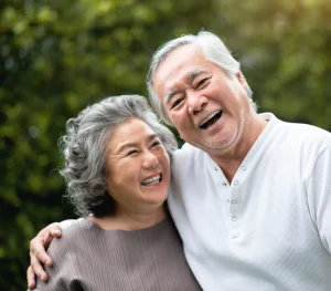 Joyful senior asian couple spending time together outdoors